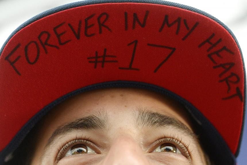 Red Bull driver Daniel Ricciardo with an inscription on his cap honouring the late driver Jules Bianchi, at the Hungaroring circuit.
