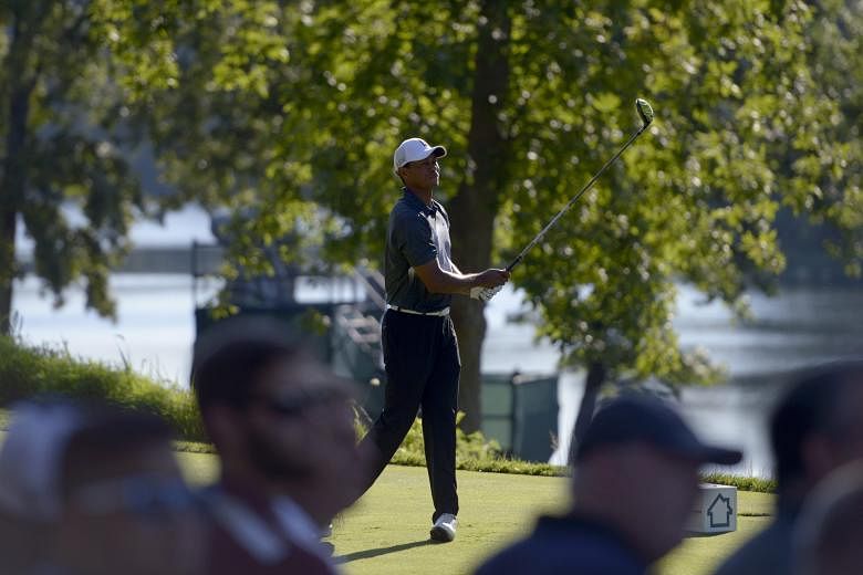 Former world No. 1 Tiger Woods, now languishing outside the top 250 in the rankings, teeing off on the 13th hole during the second round of the Quicken Loans National. While his latest swing changes have not borne fruit, he has putted aggressively an
