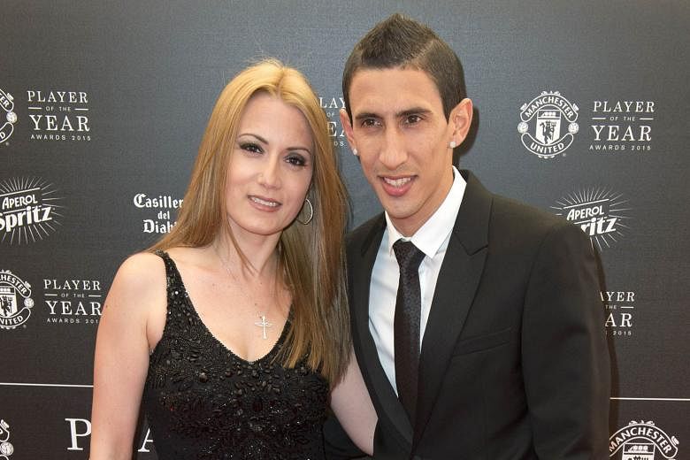 Argentina midfielder Angel di Maria and his wife Jorgelina posing on the red carpet as they arrived for United's Player of the Year Awards on May 19. Old Trafford fans have barely seen him at his best but after a single season, he is off to PSG to ch