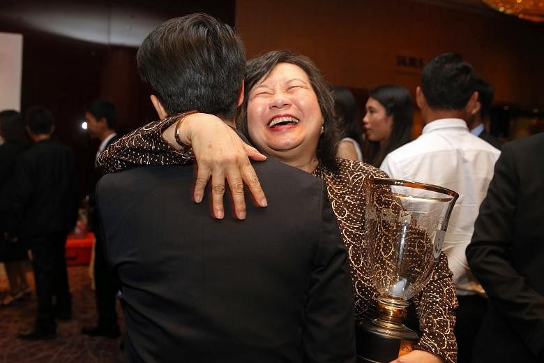 May Schooling, who received the Sportsman of the Year award on behalf of her United States-based son Joseph, being congratulated at the Singapore Sports Awards ceremony at Marina Mandarin Hotel.
