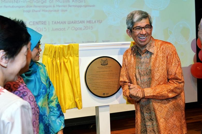 Communications and Information Minister Yaacob Ibrahim unveiling the national monument plaque for Istana Kampong Gelam yesterday. The 172-year-old building is the country's 70th national monument.