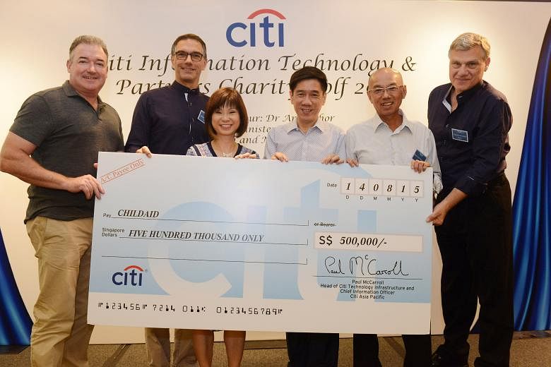Holding the $500,000 cheque are (from left) Mr Paul McCarroll, head of Citi Technology Infrastructure; Mr Michael Zink, Citi Singapore country officer and head of Asean; guest of honour Amy Khor, Senior Minister of State for Health and Manpower; Mr A