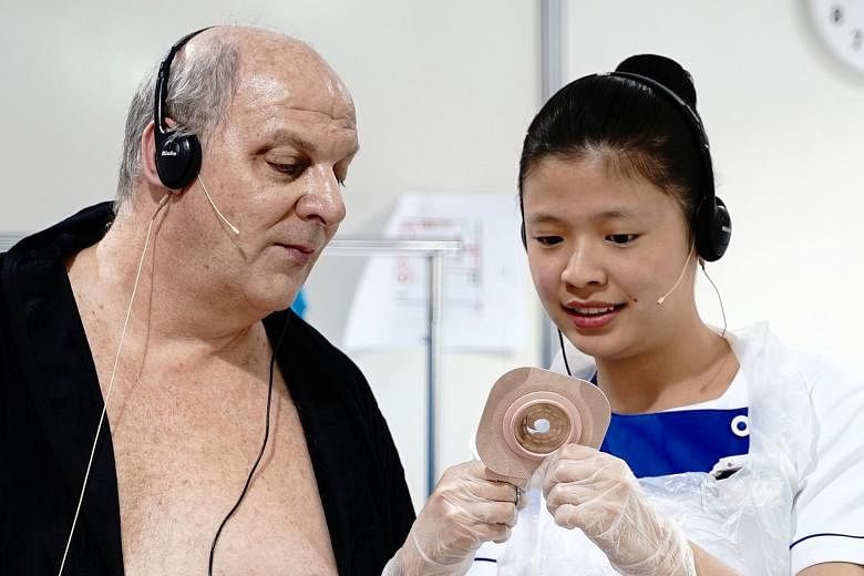 Ms Lim Ling, a second-year student from Nanyang Polytechnic, seen here with her "patient" at at the biennial WorldSkills contest, dubbed the "Olympics of Skills". She took the bronze medal in the health and social care category.
