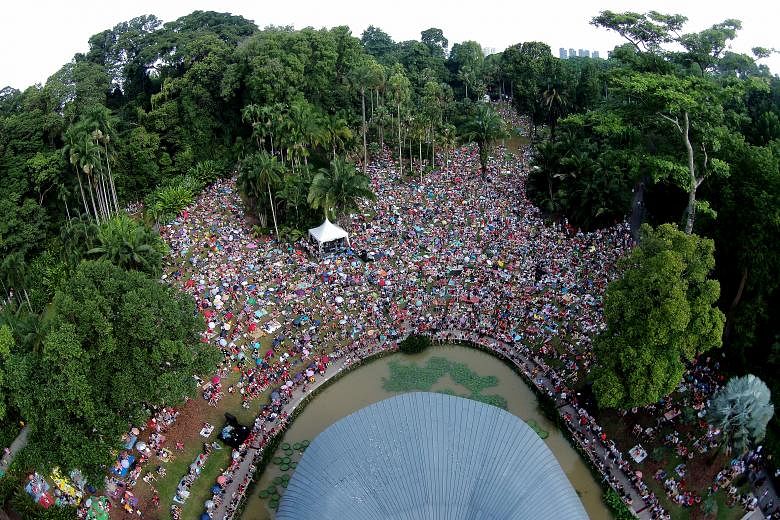 Visitors enjoying a concert at the Botanic Gardens over the jubilee weekend. Since the Gardens obtained its Unesco World Heritage Site status last month, it has seen a 35 per cent rise in the number of visitors.