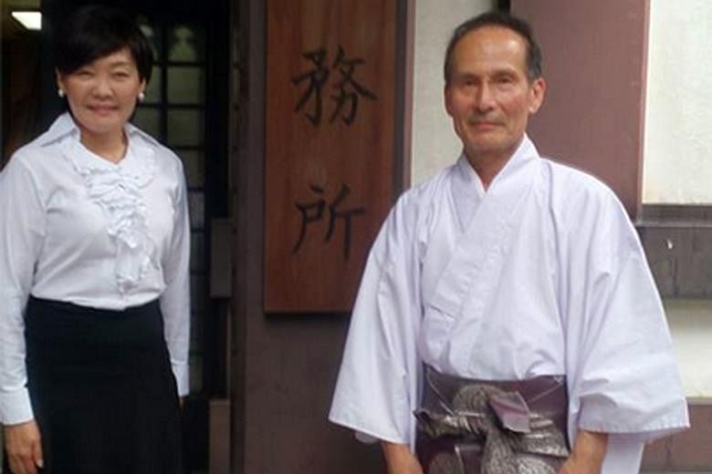 Mrs Akie Abe posted a picture of herself standing next to a senior priest at the Yasukuni shrine on Tuesday.
