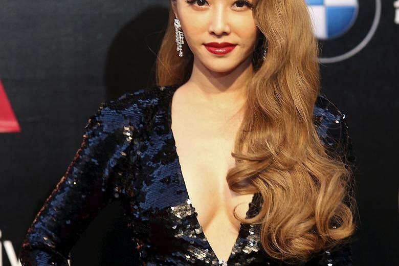Singer Jolin Tsai (left) makes a bold statement with her deep-red lips.