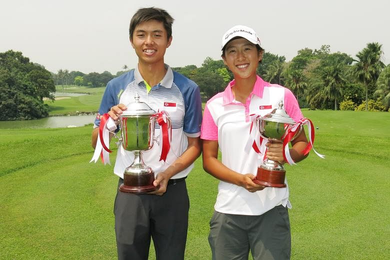 James Leow (far left) and Jen Goh with their trophies after their victories in the Singapore National Amateur Championship yesterday at Tanah Merah Country Club's Tampines Course.