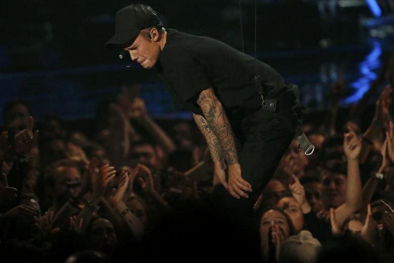 Justin Bieber breaking down in tears at the MTV Video Music Awards on Sunday after singing What Do You Mean?, which broke the record for the biggest first week on streaming service Spotify.