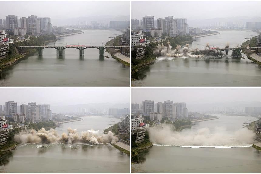 The bridge, built in 1971, was 246.6m long and 12m wide. A new one will be constructed at the same location as a replacement, the local media reported. (From top) A series of photos captures the Lishui bridge collapsing during a controlled demolition