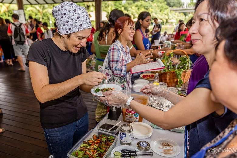 #SgEatWithUs is a movement encouraging people to bond over home-cooked meals, such as at a carnival they participated in at Orto, formerly known as Bottle Tree Park.