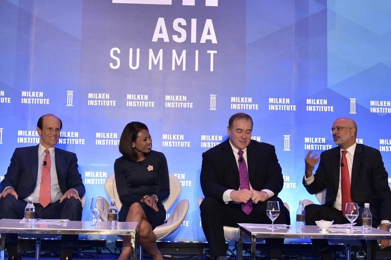 From left: Mr Michael Milken, chairman of Milken Institute; Ms Haslinda Amin, news correspondent of Bloomberg Television; Mr Scott Minerd, global chief investment officer of investment and advisory firm Guggenheim Partner; and DBS chief executive Piy