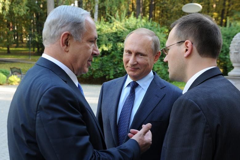Russian President Vladimir Putin (centre) with Israeli Prime Minister Benjamin Netanyahu (left) during their meeting at the Novo-Ogaryovo residence outside Moscow on Monday.