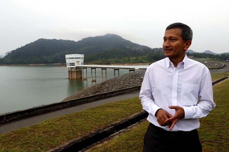 Dr Vivian Balakrishnan (left), who will head the Ministry of Foreign Affairs, has played key roles in brokering environmental deals on the global stage.
