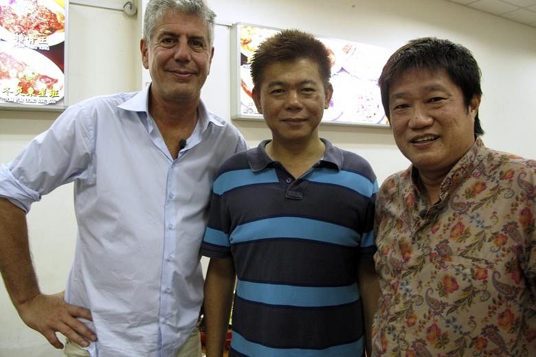 TV chef Bourdain with chef-owner Ng Kim Hock (above, middle) of Geylang Claypot Rice in Singapore and street food expert K.F. Seetoh; and an artist's impression (right) of the proposed market. Chef- entrepreneuer Anthony Bourdain (right) with one of 