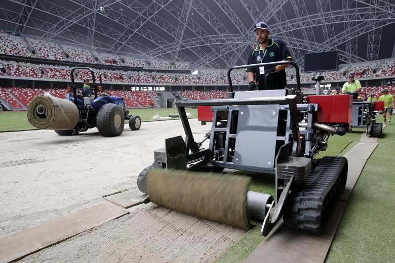 Work has been completed on the National Stadium's replica field, with the original surface taken for maintenance.
