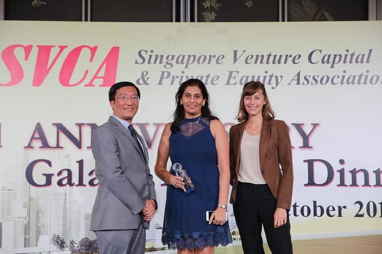 Mr Chris Loh (left), partner of Axiom Asia Private Capital and a member of the judging panel, with Jungle Ventures chief financial officer Vaishali Cooper (centre), and analyst Alice Besomi at the SVCA awards on Thursday.