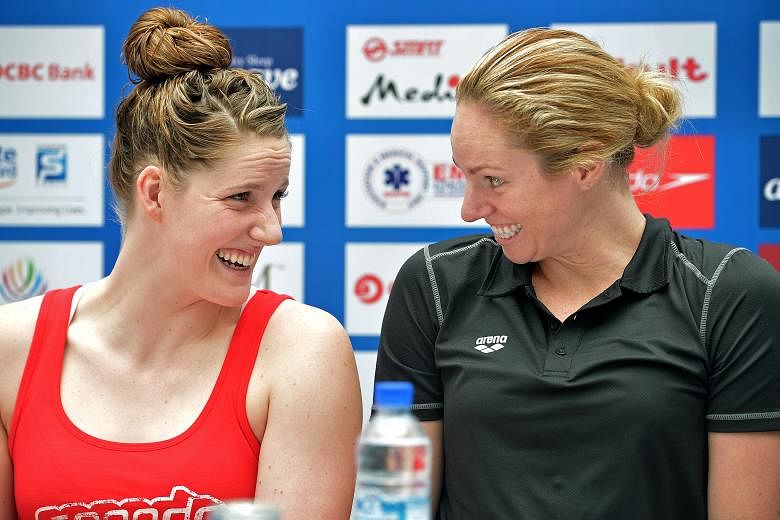 Backstroke rivals and yet good friends, American Missy Franklin (left) with Australian Emily Seebohm at the Swimming World Cup press conference at Kallang Wave Mall.