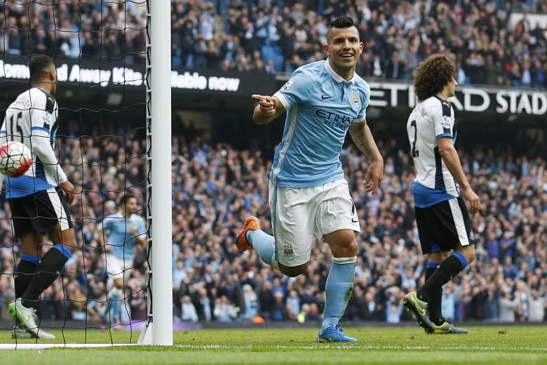 Sergio Aguero celebrating after scoring Manchester City's sixth goal against Newcastle. The win put them provisionally on top of the standings.