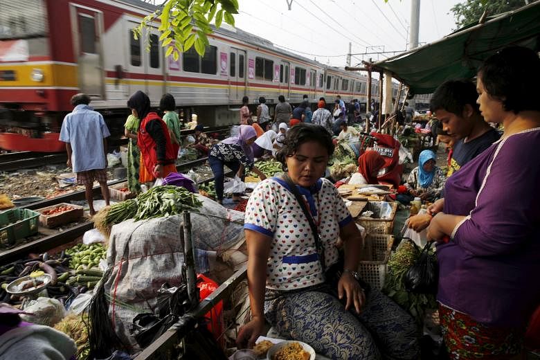 A vegetable market in Jakarta, Indonesia. A turnaround in Indonesia and Malaysia may happen as soon as next year as expansion across the world picks up, says World Bank chief economist for the East Asia and Pacific region Sudhir Shetty.