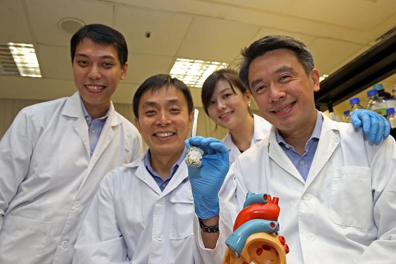 The researchers from NUS and the National University Heart Centre (from left) Mr Kenneth Chan, Associate Professor Leo Hwa Liang, Dr Elynn Phang and Dr Jimmy Hon with their novel prosthetic heart valve called VeloX, that can be implanted in a patient