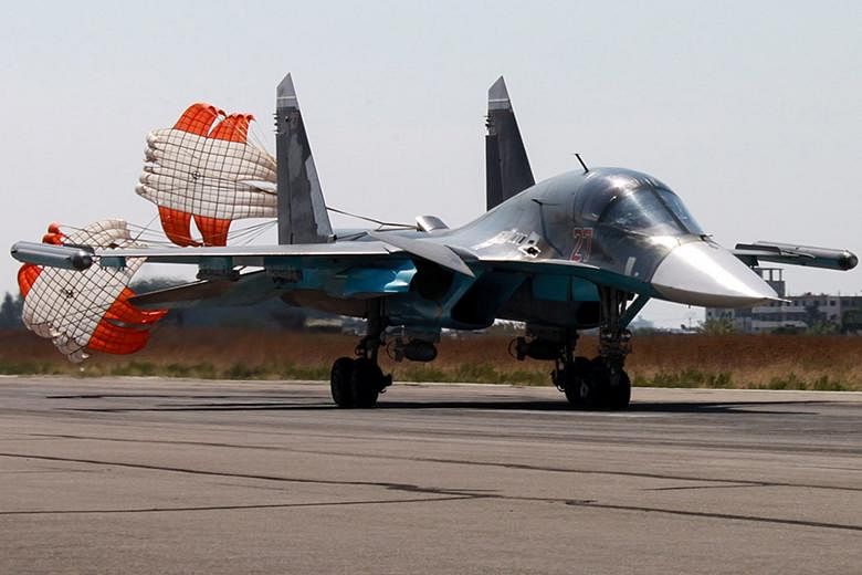 A Russian SU-34 fighter bomber landing at the Syrian Hmeymim airbase outside Latakia. Russian fighters are carrying out air strikes against what Moscow says are ISIS facilities. But Washington says more than 90 per cent of Russia's strikes target the