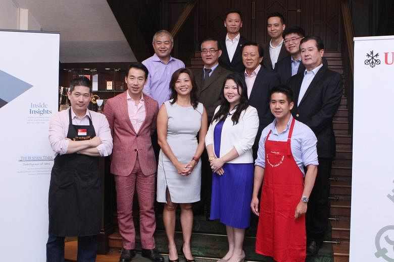 The panel of The Business Times Wine Challenge 2015 - CEOs' Choice, who include chief judge Lim Hwee Peng (front row, far left) and Les Amis wine director Timothy Goh (front row, left).