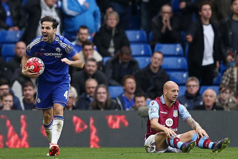 Chelsea midfielder Cesc Fabregas (left) celebrating after an own goal by Aston Villa defender Alan Hutton put the Blues 2-0 up at Stamford Bridge on Saturday. It was only the champions' third Premier League win after a horrible start to the season.