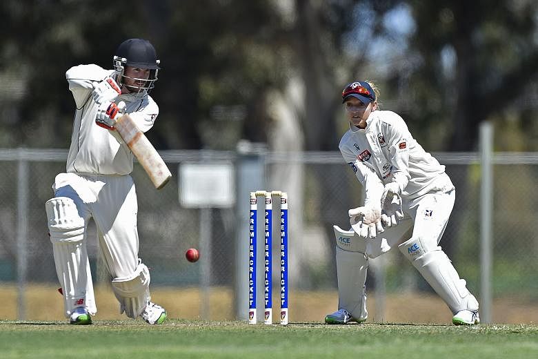 English wicket- keeper Sarah Taylor playing for Northern Districts against Port Adelaide in South Australia's premier men's cricket competition, the first woman to do so. Port Adelaide are at 227-3 after the first innings of the two-day match.