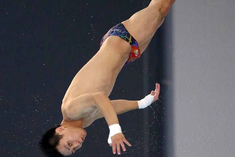 Above: China's Wang Anqi won the 10m platform for his third gold of the Grand Prix. Right: His compatriot, Wu Chunting, the world junior champion, took the 3m springboard title to complete her treble as well.