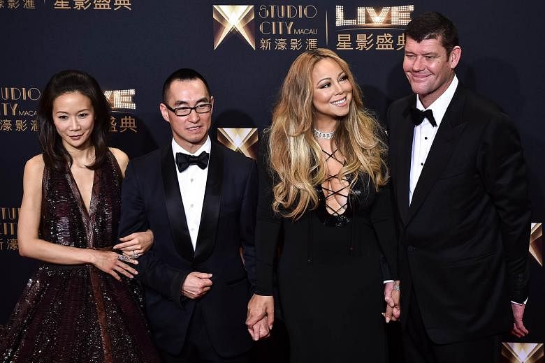 South Korean girl group Sistar (right) on the red carpet. Chief executive officer of Melco Crown Entertainment Lawrence Ho and his wife (both far left) with singer Mariah Carey and her boyfriend, co-chairman of Melco Crown Entertainment James Packer,