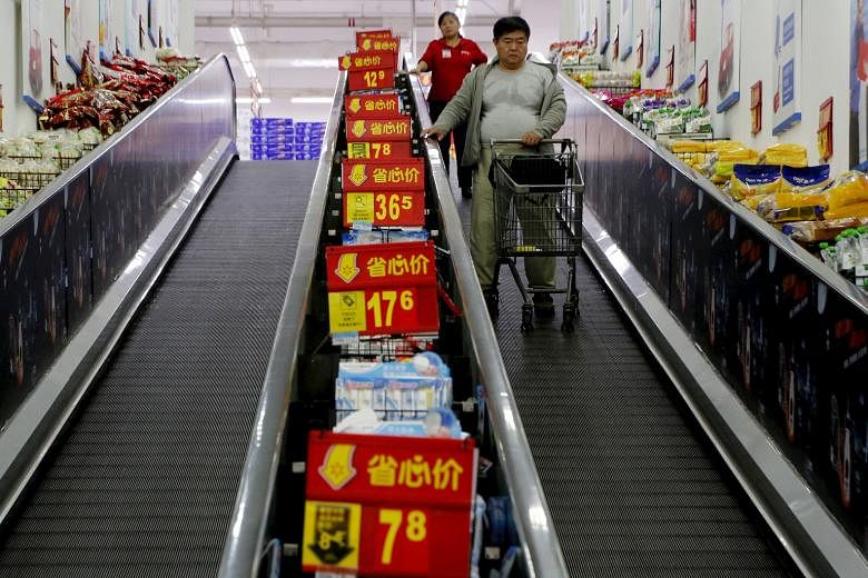 Shoppers at a supermarket in Beijing. China is aiming to double its 2010 gross domestic product and per-capita income of residents in both cities and rural areas by 2020, a goal which was first announced by former president Hu Jintao in 2012.