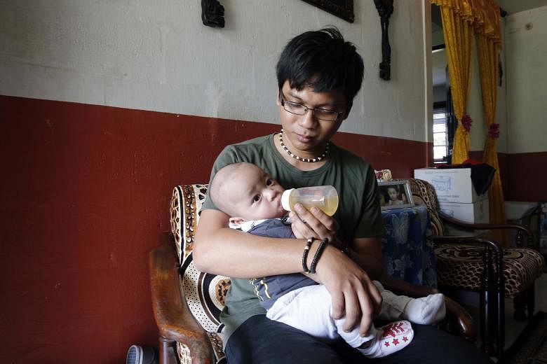 SMRT technical officer Muhamad Shah Rizal Hassan, 28, took a second week of paternity leave in September to spend more time with his four-month-old son, Muhamad Shafi Rayhan. More companies have taken up the Government's call to double paternity leav