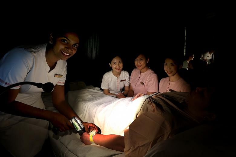 National Heart Centre Singapore nurses (from left) Abirami Nagarasan,34, Xiao Bing, 26, Siti Fidawati Jasman and Wu Wing Yin were part of a team that brainstormed for a solution to avoid disrupting other sleeping patients while they attended to one d