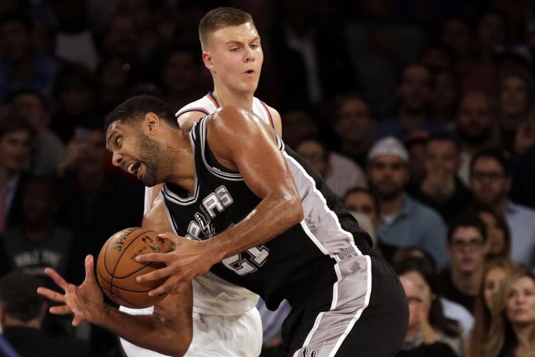 Tim Duncan (front, driving past New York's Kristaps Porzingis on Monday), may not bring in as many points as his San Antonio team-mates. But his coach Gregg Popovich says the 39-year-old centre is a force on court with his defence, rebounding and lea