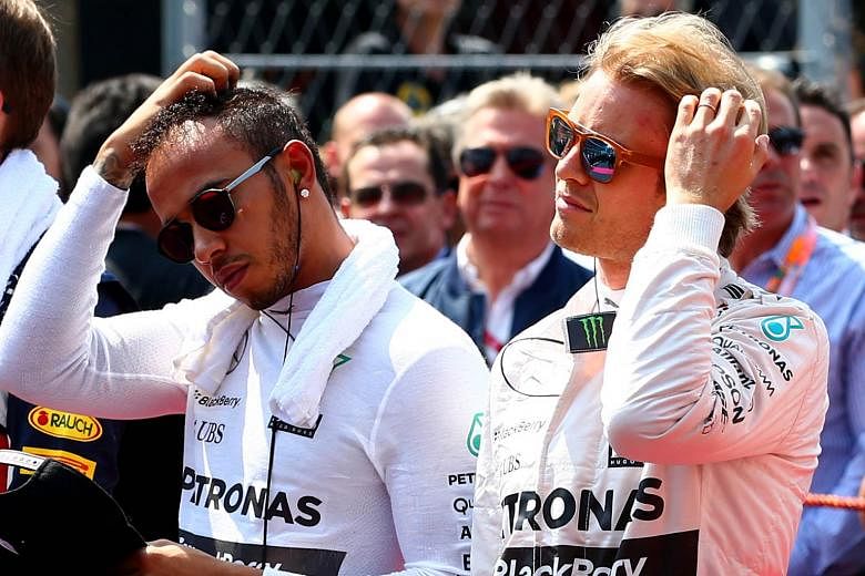 Lewis Hamilton (left), on the grid with Nico Rosberg before Sunday's Mexican Grand Prix. The world champion added to the bad blood between the pair, suggesting that he, instead of his Mercedes team-mate, would have won the race if he had not been ask