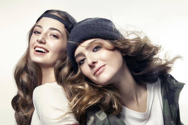 Nudestix founder Jenny Frankel's daughters Taylor (left) and Ally (far left) are the faces of the brand and help develop the make-up pencils (above).