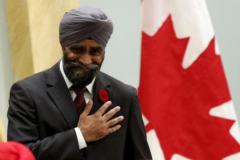 New Canadian Defence Minister Harjit Sajjan being sworn in at Rideau Hall in Ottawa, Canada on Wednesday. The former police officer, who has served three stints in Afghanistan, was born in India.