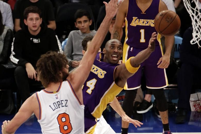 Los Angeles Lakers forward Kobe Bryant (centre) trying to shoot past New York Knicks centre Robin Lopez (No. 8) at Madison Square Garden on Sunday. The Knicks triumphed 99-95.