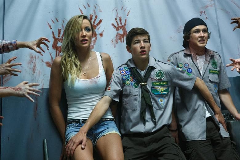 Two high school friends (Tye Sheridan, above centre; and Logan Miller, above right) and a strip-club waitress (Sarah Dumont, above left) find their way to safety in Scouts Guide To The Zombie Apocalypse.
