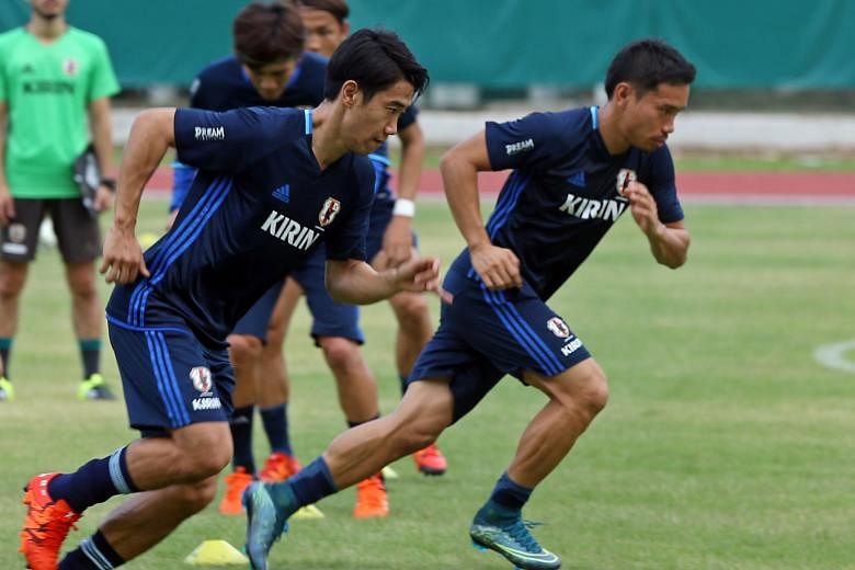 The experience of playing in Europe for the likes of Borussia Dortmund's Shinji Kagawa (far left, training at Bishan Stadium yesterday) is seen by team-mates as giving the Blue Samurai more bite against Singapore.