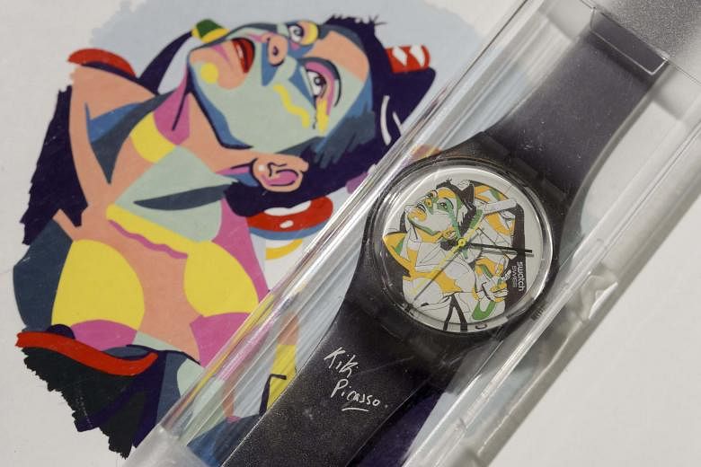 Swatches designed by Kiki Picasso (above) and Keith Haring (left) were part of the collection that was auctioned on Tuesday.