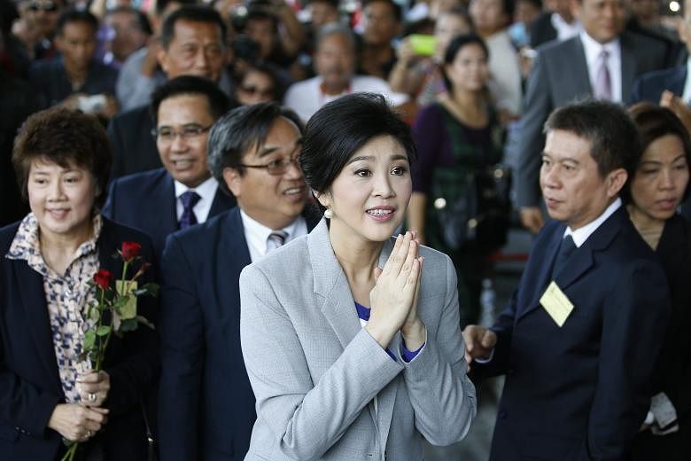 Former Thai prime minister Yingluck Shinawatra offering a traditional greeting on arrival in court last month to face criminal charges stemming from her government's rice subsidy scheme.