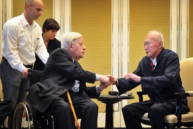 Former German chancellor Helmut Schmidt (left) and founding Prime Minister Lee Kuan Yew having a warm exchange at the end of a press conference at the Shangri-La hotel in 2012. The two close friends spent three days discussing world politics during M