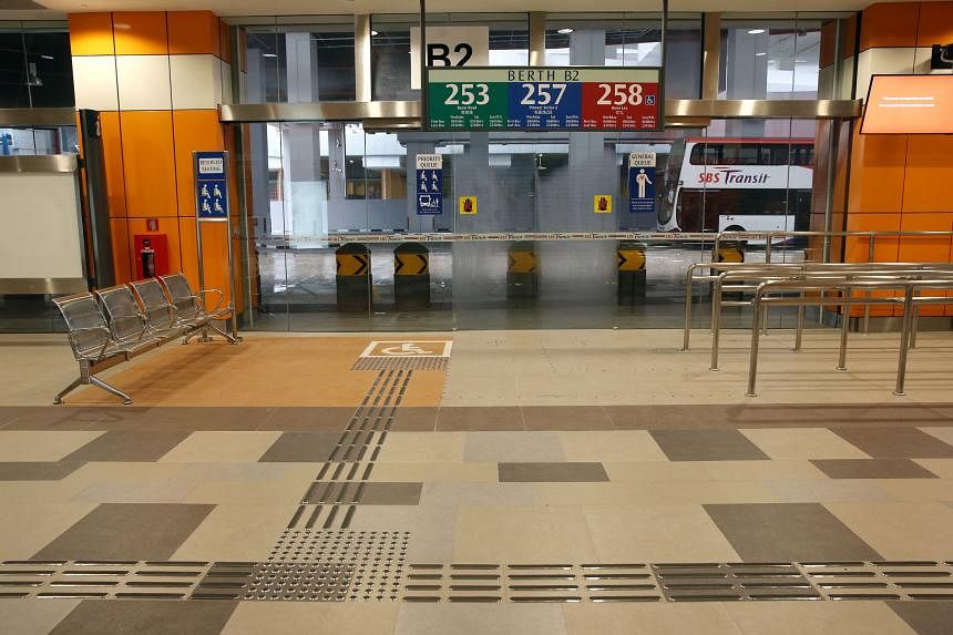 (Far left) Brightly coloured signs mark out priority zones near the boarding berths at the Joo Koon Integrated Transport Hub, which opens on Saturday. The zones have seats for the elderly and those in need as well as tactile paving to help the visual