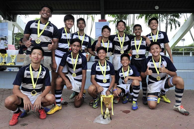 St Andrew's Secondary School beat arch-rivals Raffles Institution 17-5 to win the Under-14 title at the Singapore Cricket Club Schools and Colleges Sevens tournament yesterday. A minute's silence was observed at the National University of Singapore's
