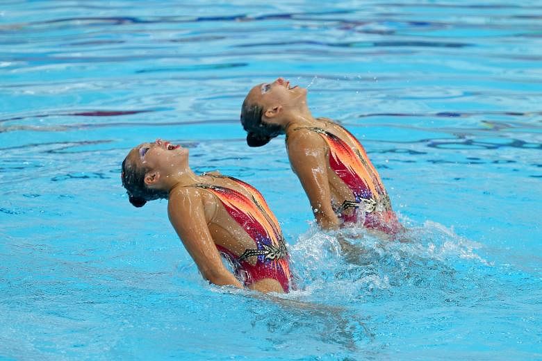Debbie Soh (left) and Gwyneth Goh in the duet free routine final at the National Synchronised Swimming Championships yesterday.