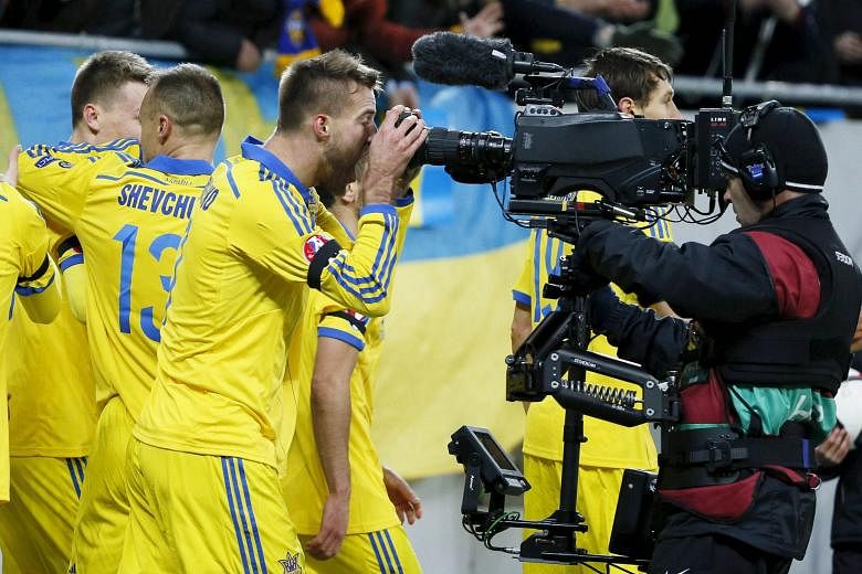 Ukraine's Andriy Yarmolenko making sure the spotlight is on him after scoring the opener in the 2-0 win over Slovenia.