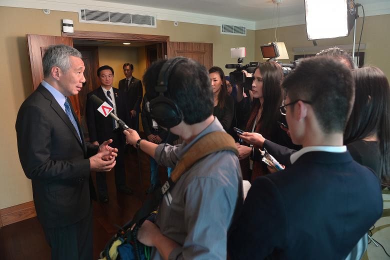 PM Lee speaking to Singapore journalists yesterday in his hotel suite at the conclusion of the G-20 Summit in Antalya, Turkey.