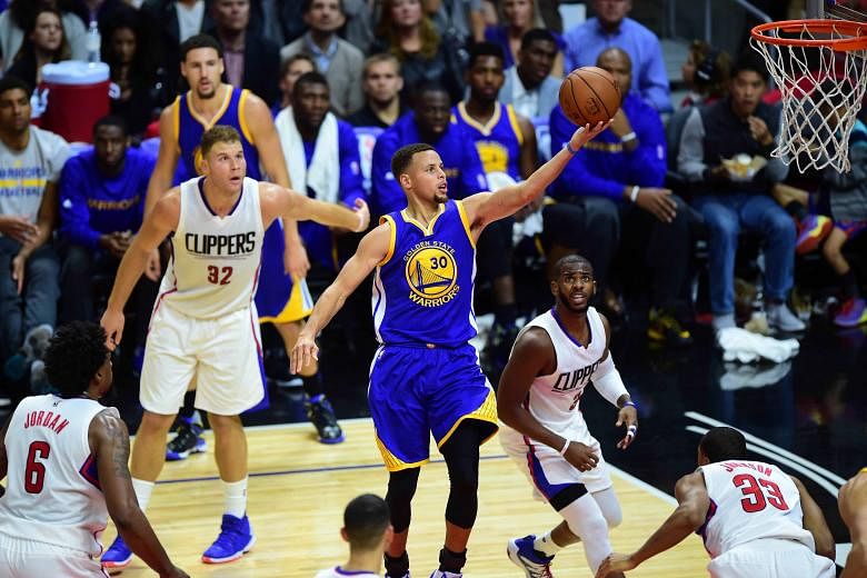 Stephen Curry (No. 30) scores for the Golden State Warriors against the Los Angeles Clippers on Thursday. He scored 40 points in the 124-117 victory after the Warriors trailed by 23 points in the first half and said their 13th consecutive win was a "