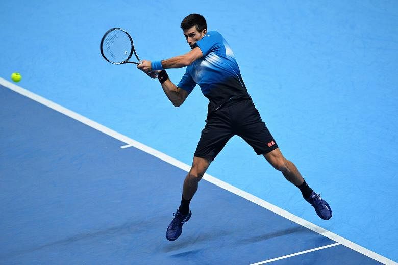 Novak Djokovic returning against Tomas Berdych during his 6-3, 7-5 win against the Czech during the ATP World Tour Finals in London on Thursday. The Serb is aiming for a record fourth consecutive title.